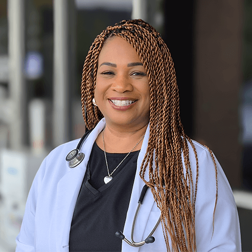 Portrait of Ingrid Herman, PNP, pediatric nurse practitioner at Silverlake Pediatrics in Pearland, Texas, smiling warmly in a clinic setting.